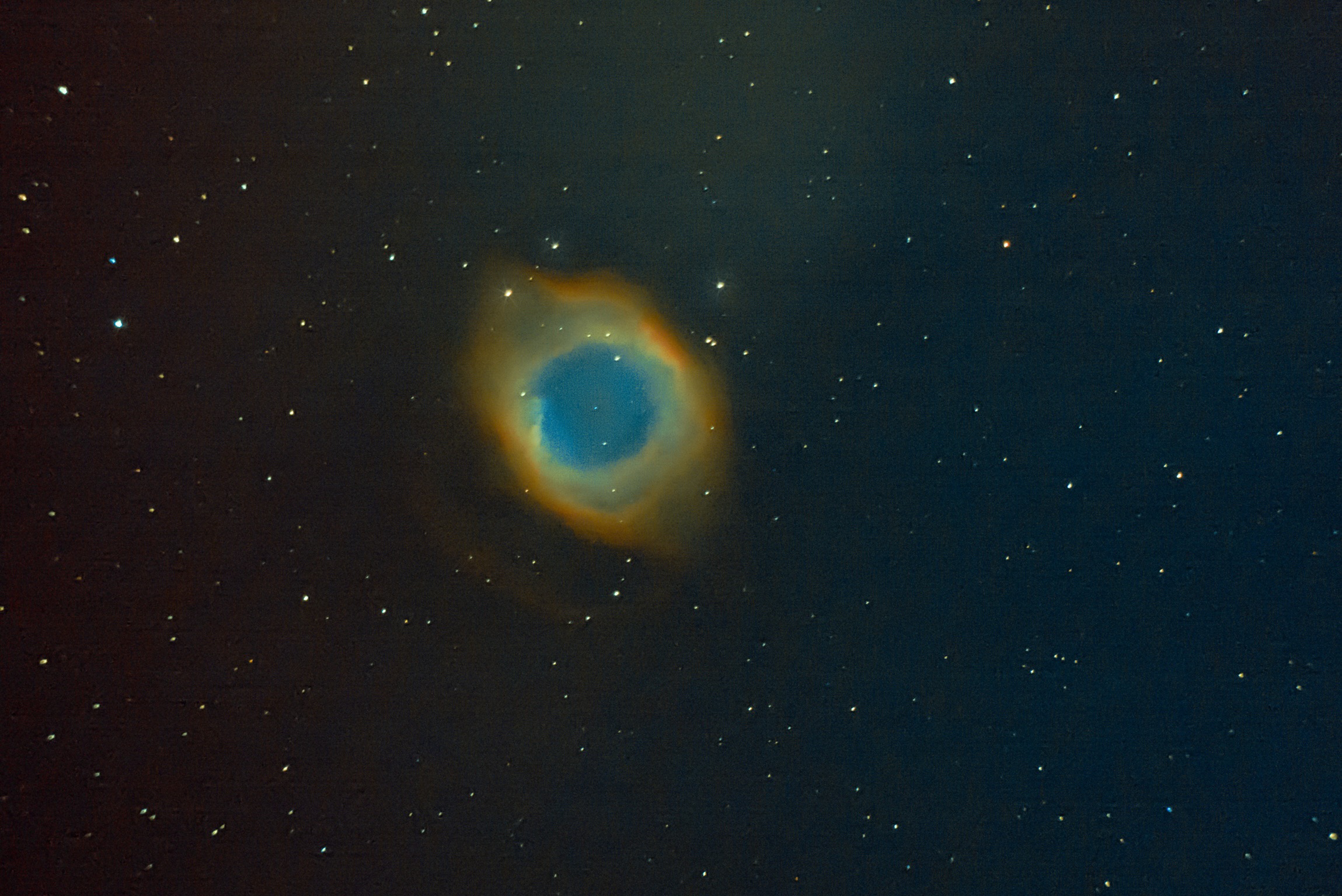 Helix Nebula,{ future of our Sun},about 700 light years away.This Nebula sheds outer layers near the end of its evolution.This is also fate of our Sun after 10 billion years.