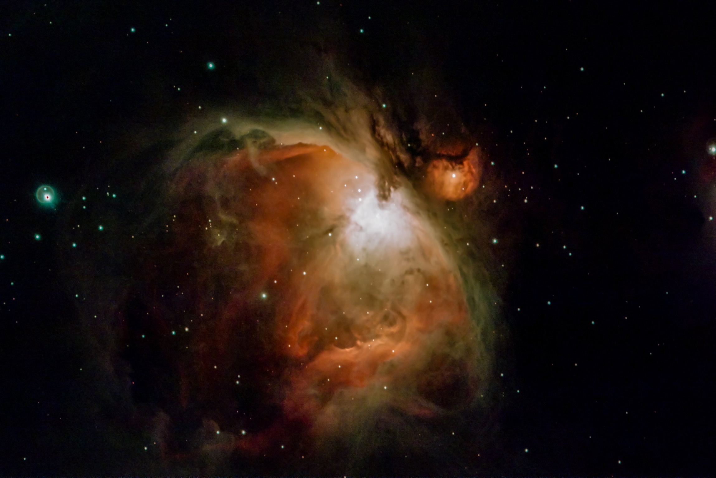 “Orion Nebula” 1500 light years away.The red hue is caused by hydrogen radiation, the green hue was a puzzle for astronomers, initially was named as the new element ‘Nebulum”,later it was determined ,it is caused by electron transition in  ionized oxygen.This radiation was all but impossible to reproduce in the laboratory,it only happens in deep space.