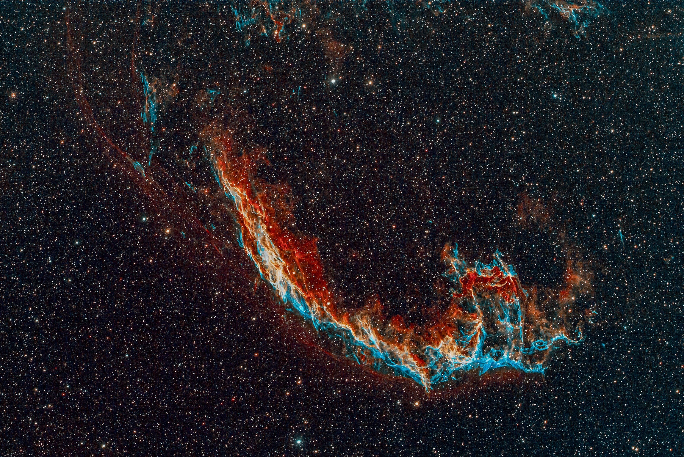 The Eastern Veil Nebula is a large supernova remnant in the constellation Cygnus. It is an expanding cloud created by the death of an exploded star. Scientists believe that the light from this supernova explosion reached Earth about 5000 years ago.