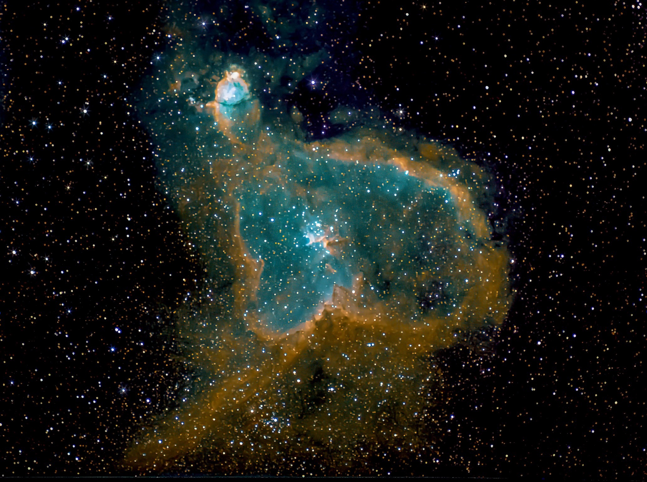 The Heart Nebula (IC 1805) is a large emission nebula in the constellation Cassiopeia. The beauty of this iconic astrophotography target is due to its mix of both bright hydrogen gas, and dark dust clouds. This glowing nebula gets its nickname from the familiar shape it resembles and is located approximately 7,500 light-years from Earth.